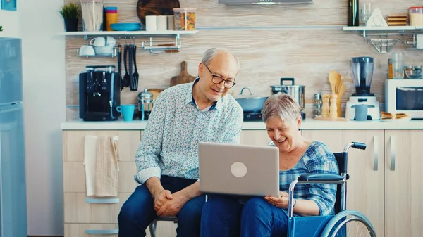 Family video call for disabled woman in wheelchair — Stock Photo, Image