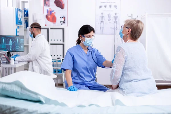 Cardiologist assistant listening heart