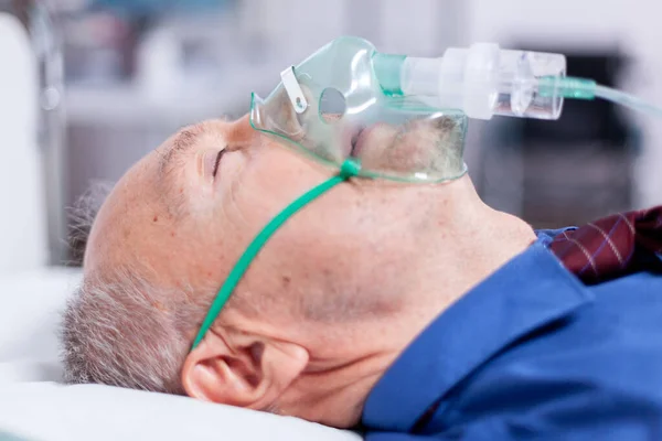 Sick old man with respiratory mask — Stock Photo, Image