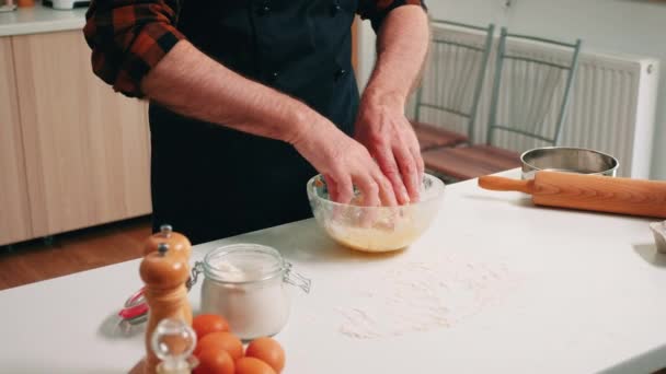 Kneading bread dough in a glass bowl — Stock video