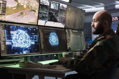 Army software developer employing AI technology in military planning and decision making processes. IT specialist uses artificial intelligence to enhance combat operational capabilities