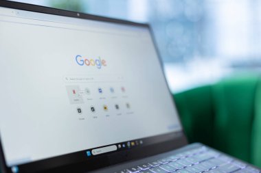 Bucharest, Romania - July 30th 2024 - Man uses Google bookmarks to find Netflix easily on his search engine, preparing to watch a movie or tv series at the corporate office. Boss entrepreneur.