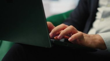Close up of businessman typing information for daily tasks on laptop, working on pc for productivity and managing company investments. Chief executive officer in personal office. Camera B.