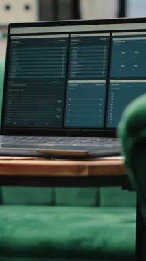 Vertical Video Empty urban corporation high end office designed for a leader, showcasing laptop with analytics and profit trends on screen. Modern global corporation workspace, business success.