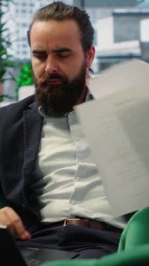 Vertical Video Overburdened director dealing with workload and financial instability, struggling to keep his business economy on the line. Unsuccessful anxious man feeling hopeless due to problems