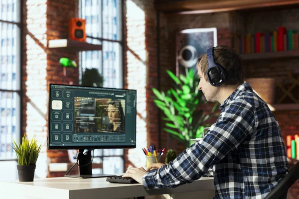 Man in home office uses artificial intelligence to generate compelling videos from basic text prompts. Person uses AI GPT generating clips using computer vision and natural language processing