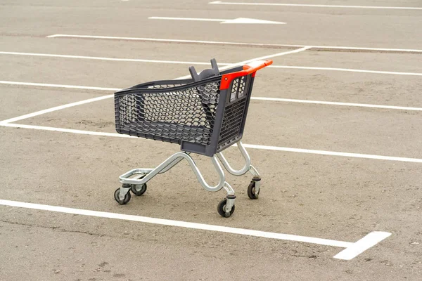 Shopping trolley in the parking lot — Stock Photo, Image