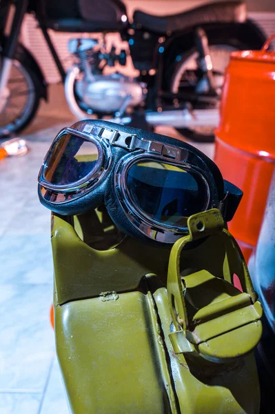 motorcyclist glasses lie on the canister