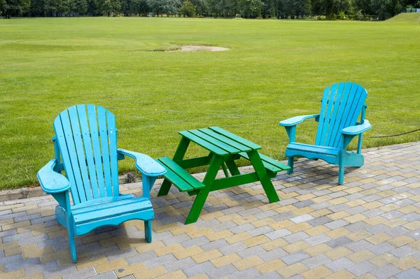 wooden furniture near the lawn