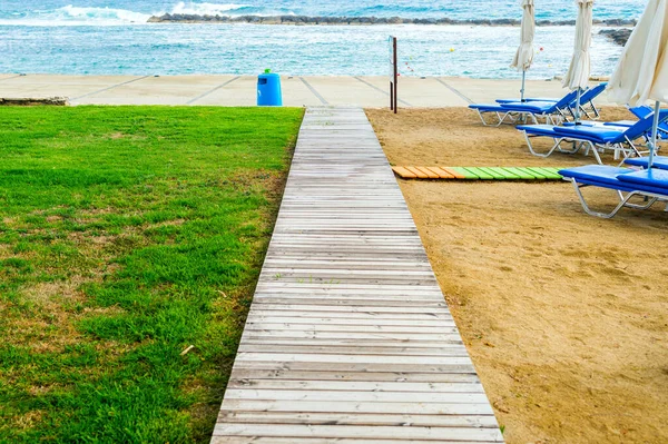 wooden walkway on plank road to the beach