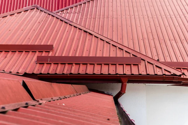 colored metal roof tiles with rain gutter