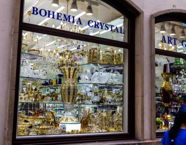 Prague, Czech Republic -July 23,2017: Storefront of famous Bohemian glass or Bohemia crystal pieces shop clipart