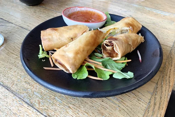 Egg roll. Patties rolls of dough stuffed with meat. Japanese or Chinese appetizer — Stock Photo, Image