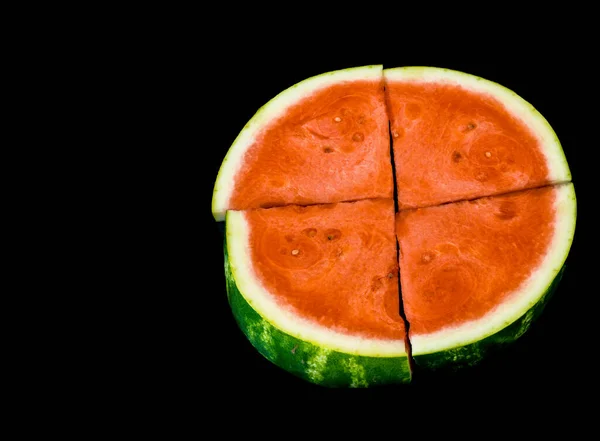 Slices of red ripe sweet watermelon on black background, closeup , selective focus