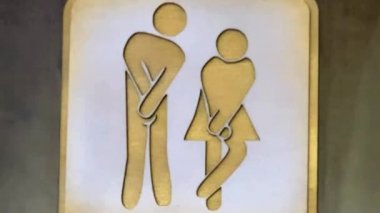 Kamu alanındaki kadın ve erkek tuvalet tabelası. Rahatlama odası için kadın ve erkek sembolleri. Umumi tuvalet işareti. İki cinsiyet için CR sembolü. Tuvalet ya da banyo. Tuvalet için belirleyici.