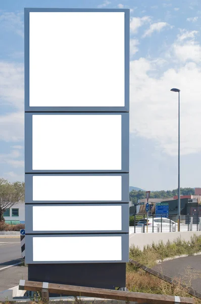 Blank advertising totem on the street with white spaces for mockup