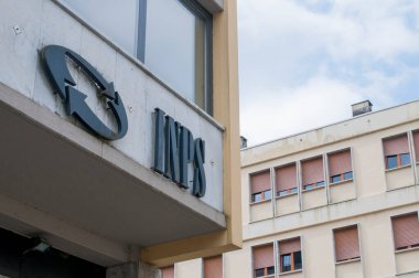 Carrara, Italy - May 24, 2020 - The INPS sign, the national social security institute that deals with providing pensions and collecting labor contributions, on the office building clipart