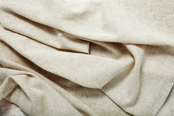 White napkin tablecloth . Wrinkled fabric background top view. — Stock Photo, Image