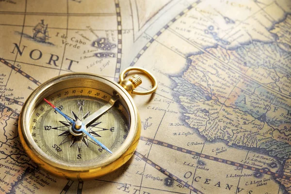 Antique compass on map Stock Image