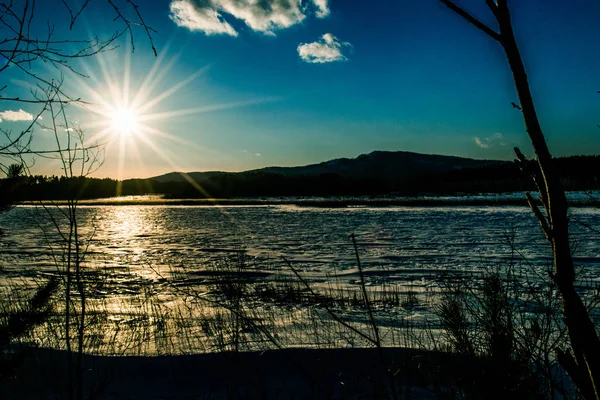 winter. sunset on the winter lake.