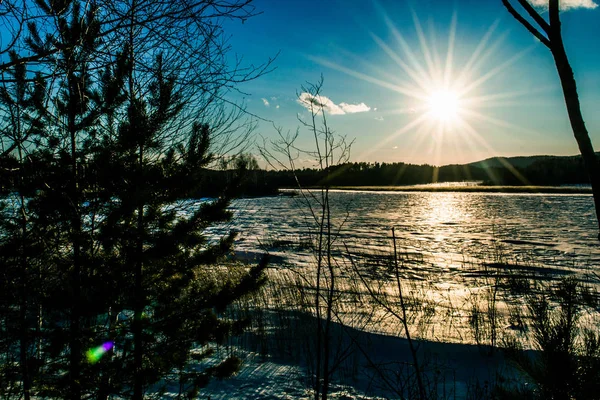 winter. sunset on the winter lake.