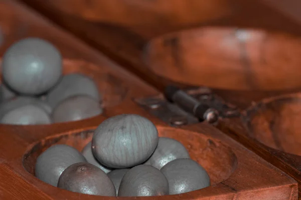 Closeup of a wooden mancala game — Stok fotoğraf