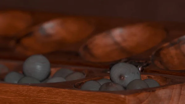 Closeup of a wooden mancala game — 图库照片