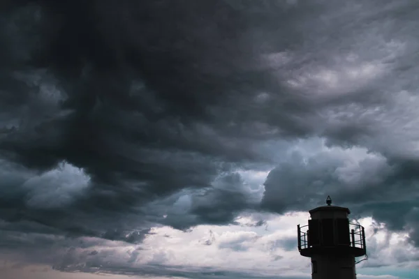 A lighthouse infront of stormy clouds — Stock Photo, Image