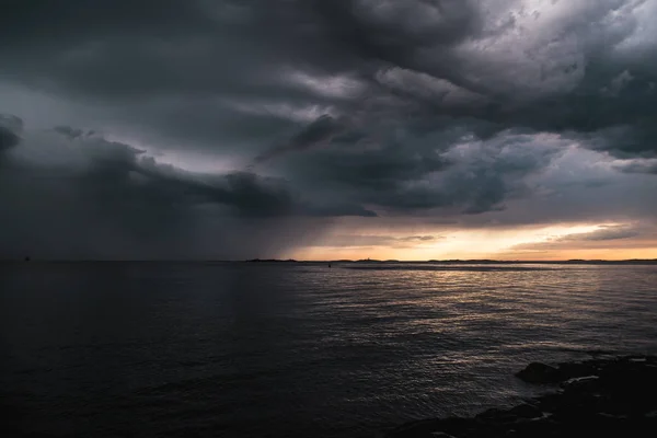 Stormy clouds by the ocean — Stock Photo, Image
