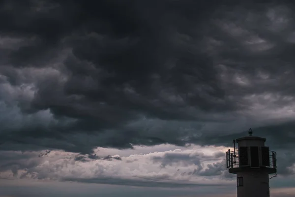 A lighthouse infront of stormy clouds — Stock Photo, Image