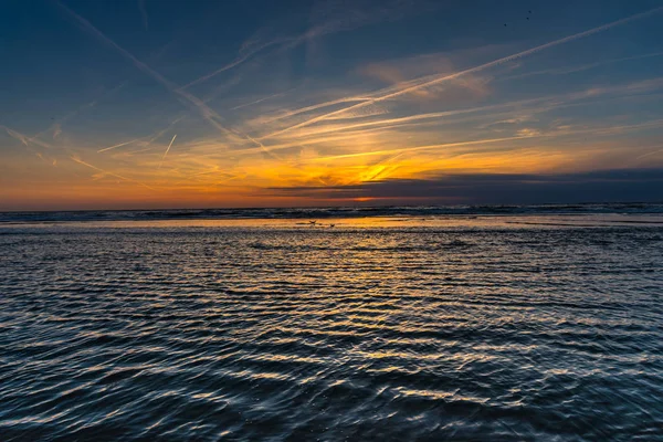 sunset sky and ocean water surface, horizon