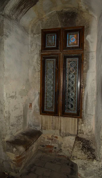 Old church interior with window and sitting place