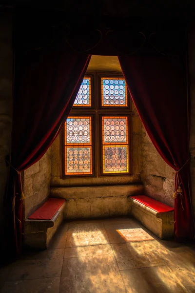 Old church interior with window and sitting place