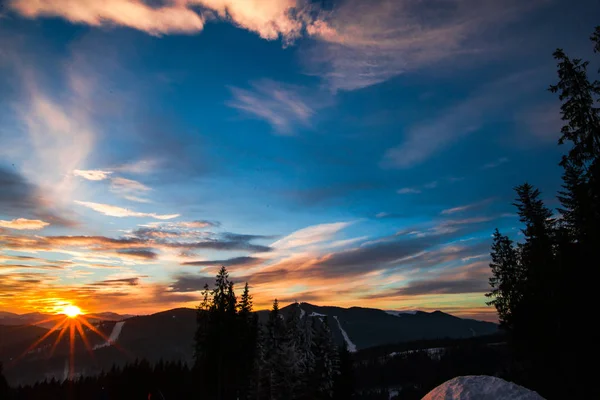 beautiful sunset sky in mountains, Winter sunset in Carpathian mountains