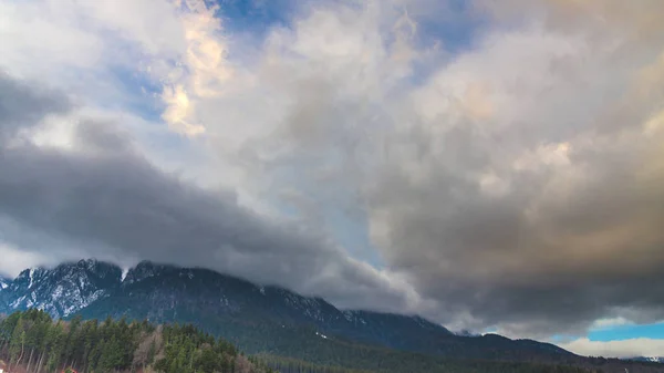 rainy clouds in alps mountains, switzerland expedition