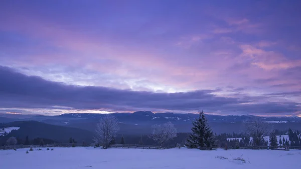 winter in mountains, violet purple sky and mountains view