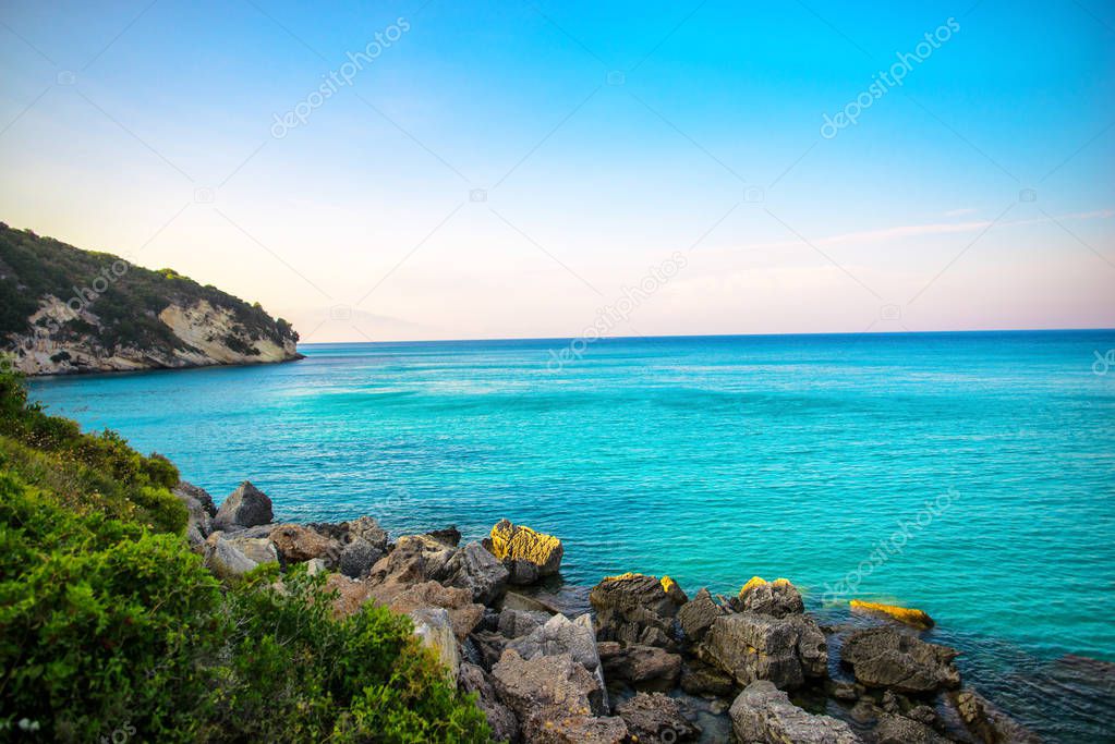 rocky coastline beach and blue sea water 