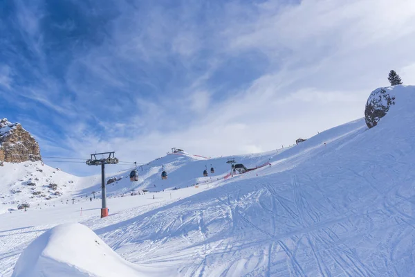 ski resort in winter mountains, skied piste with Ski lift