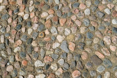 Arnavut kaldırımı, tasarım ve arka plan doku ile döşeli eski yol yüzeyi.