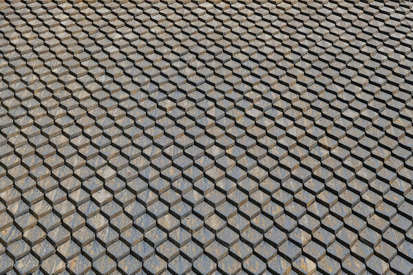 Old gray roof background made of tarred square tiles. Finland