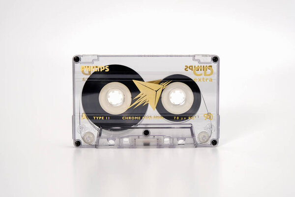 PRAGUE, CZECH REPUBLIC - NOVEMBER 29, 2018: Audio compact cassette PHILIPS CD extra chrome 90. Audio cassette on a white background front view. Analog format for audio playing and recording.