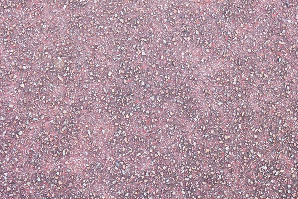 Purple asphalt pavement texture background. Close up with small stones for design.