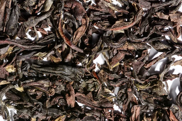 Darjeeling indiano solto fundo de chá preto e textura. macro . — Fotografia de Stock