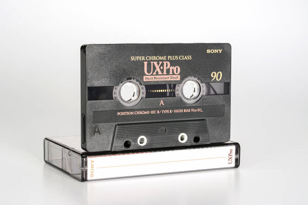 PRAGUE, CZECH REPUBLIC - FEBRUARY 20, 2019: Audio compact cassette Sony UX-Pro 90 super chrome plus class, Heat resistant shell on plastic box left. Audio cassette on a white background.