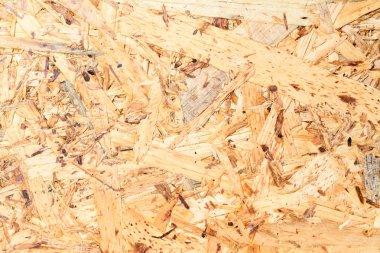 OSB Yönetim Kurulu doku ve arka plan, bir ahşap sunta kumlu kahverengi talaş yapılmış. Mdf ahşap kaplama görünümünü kapat.