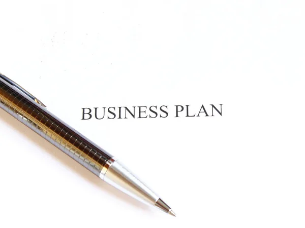 business plan on the white paper with pen