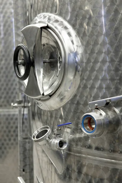 Fermentation in stainless steel tanks in the wine production. Modern manufacture of winemaking. South Moravia - the center of wine tourism in Czech Republic - Central Europe.