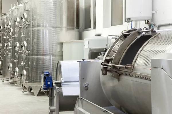 Fermentation in stainless steel tanks in the wine production. Modern manufacture of winemaking. South Moravia - the center of wine tourism in Czech Republic - Central Europe.