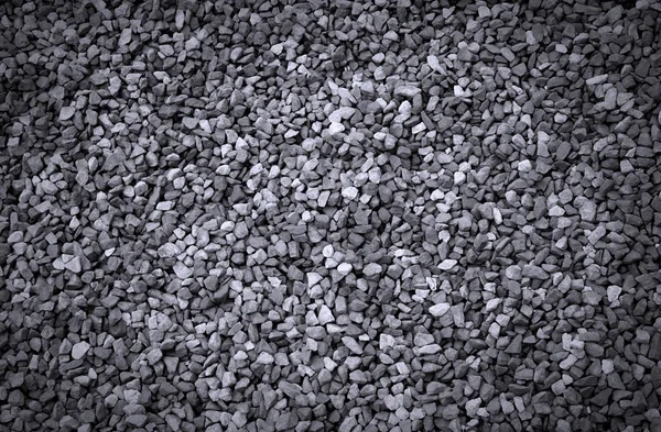 Textur aus kleinen grauen Kiessteinen — Stockfoto