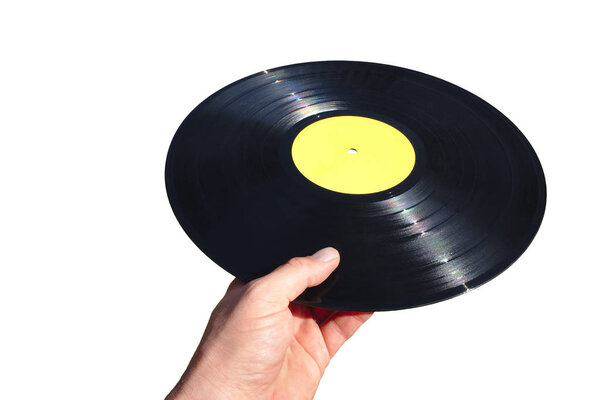 Hand holding a vinyl record isolated on white